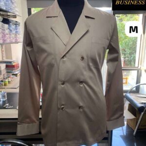 Front view of beige double-breasted jacket on mannequin with chest pockets and button detail.