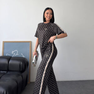 Full-length view of dark monogram two-piece set with beige side stripe and relaxed wide-leg trousers. available for wholesale in Turkey.