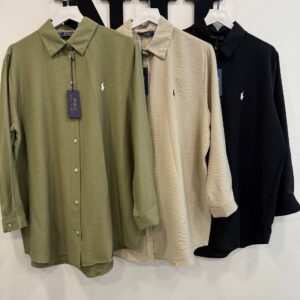 Three textured long-sleeve button-up shirts in olive, beige and black with point collars and small embroidered logos.