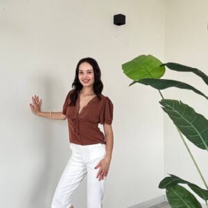 Brown V-neck blouse with lace trim and puff sleeves; fitted white capri pants and heels. - available for wholesale in Turkey