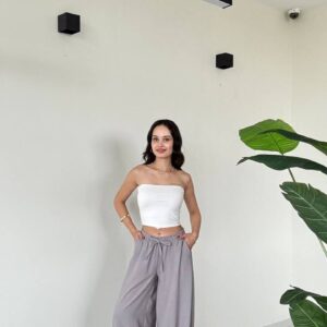 Model in a white strapless tube top paired with light gray wide harem pants featuring gathered ankles - available for wholesale in Turkey