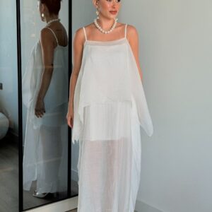 Floor-length white dress with thin spaghetti straps, layered sheer panels, and flowy asymmetrical hem. - available for wholesale in Turkey