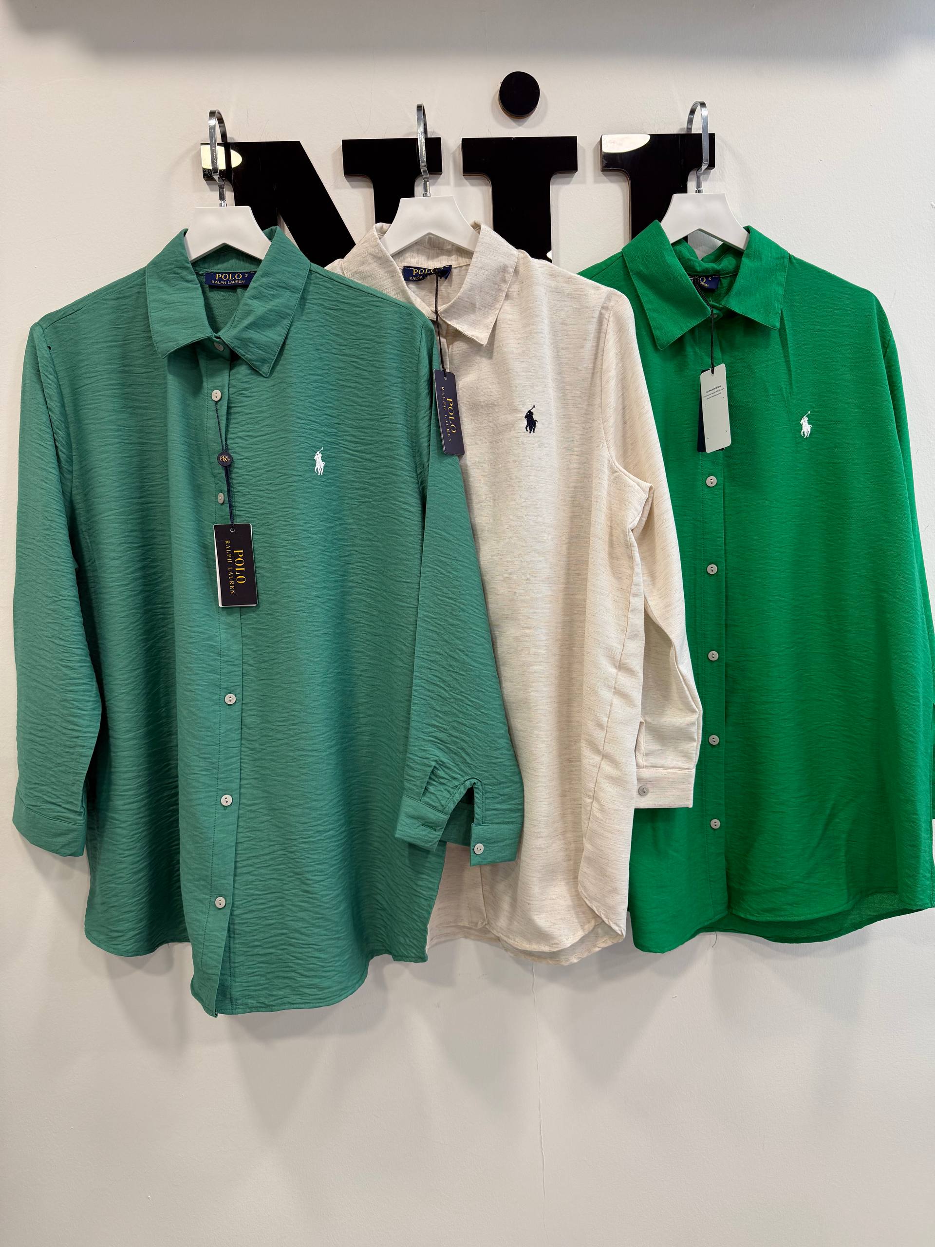 green-teal-trio-close-3156 Close frontal shot of three shirts in teal, light beige and bright green showing fabric texture, collars and button placket.