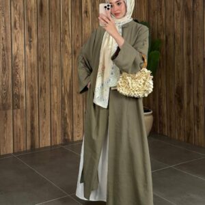 Full-length olive modest abaya with wide sleeves, cream silk scarf and woven textured handbag. available for wholesale in Turkey.