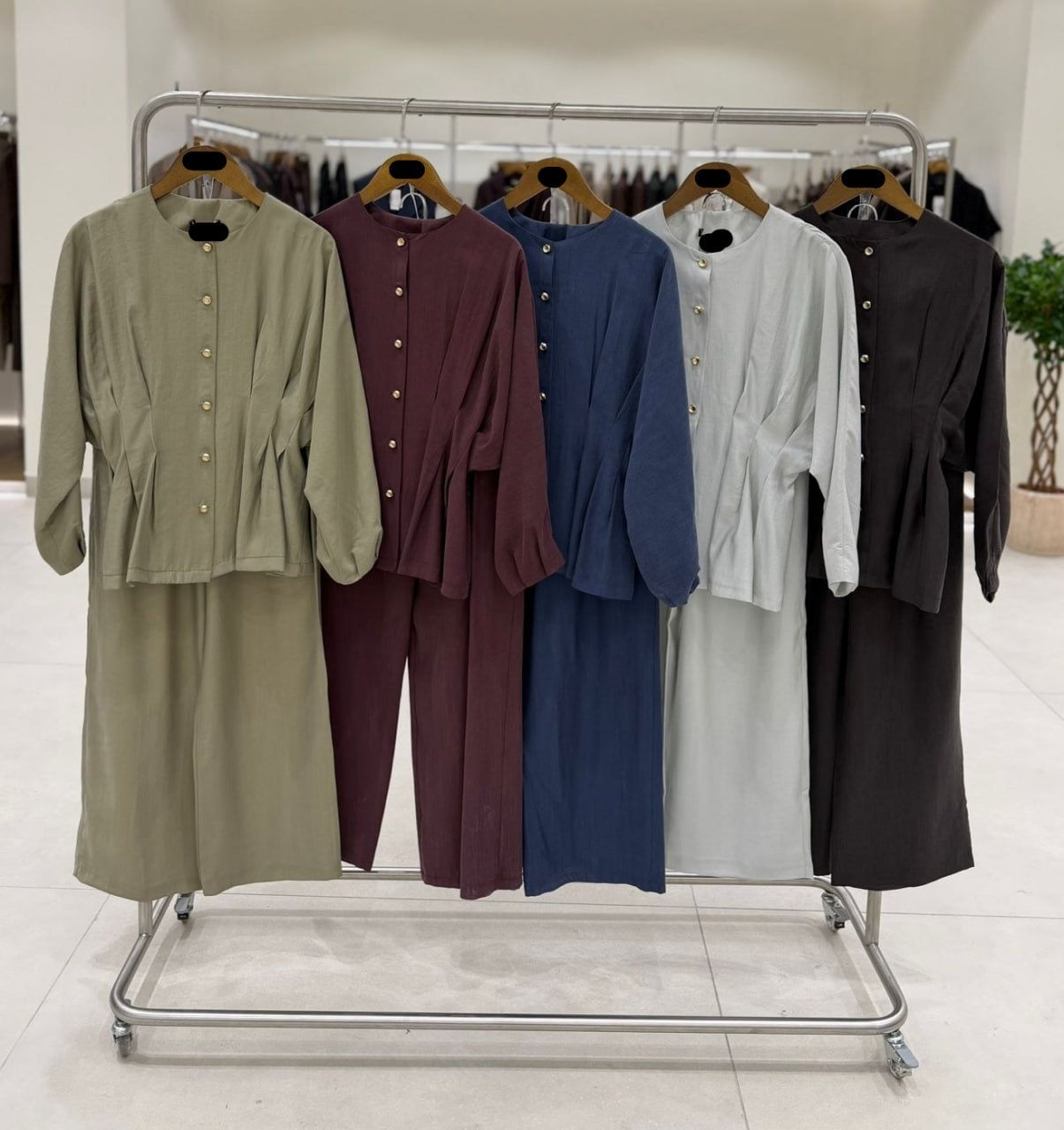 full-length-pale-set-5567 Full-length mirror image of pale grey flowy two-piece with front buttons and relaxed wide trousers.