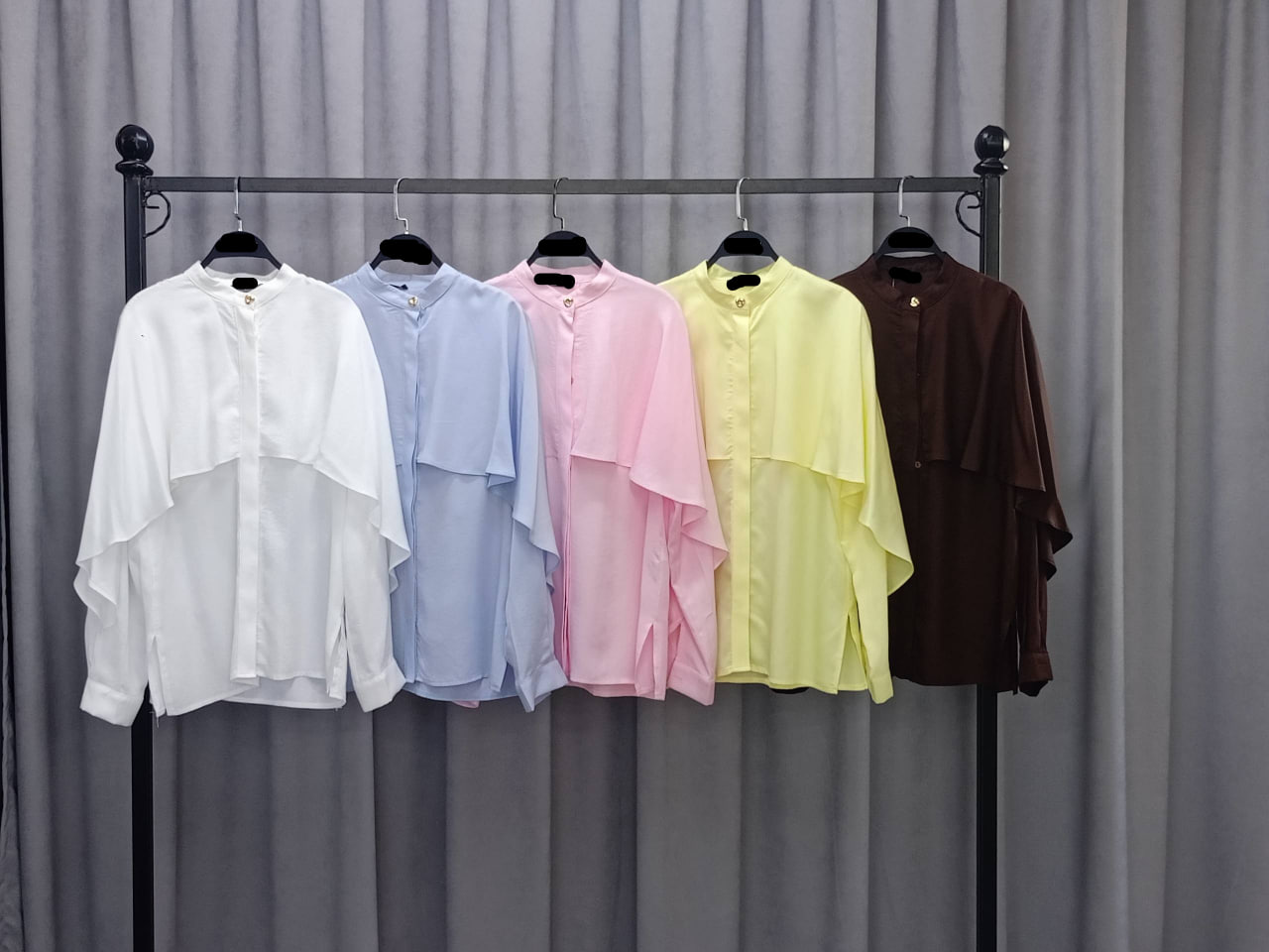 pastel-blouse-collection-1947 Five long-sleeve chiffon blouses in white, light blue, pink, pale yellow, and brown with cape overlay.