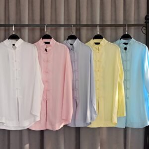 Row of five pastel mandarin-collar tunics on hangers in white, pink, lilac, yellow, and sky blue shades.
