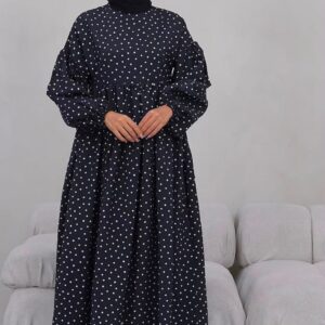 Front view of black maxi dress with white polka dots, high neckline and long puff sleeves. available for wholesale in Turkey.