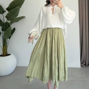 Front view of white peter-pan blouse with balloon sleeves and crinkled olive midi skirt. available for wholesale in Turkey.