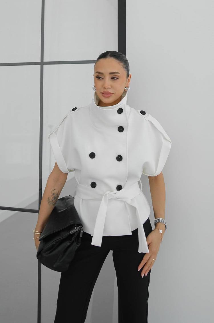 white-structured-top-front-6602 Front view of white structured double-breasted top with high funnel collar, contrasting large black buttons and tied waist belt.