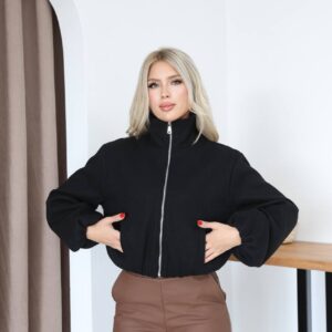 Front view of a black jacket with a silver center zipper, gathered cropped hem, and oversized sleeves.