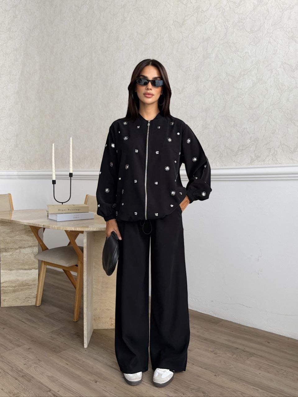black-embellished-set-front-7351 Front view of a black zip-front jacket with silver embellishments and matching wide-leg trousers