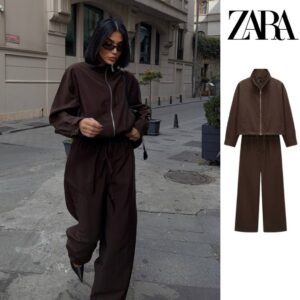 Dark brown zip-front jacket and straight wide-leg trousers shown on a model and in a flat lay.