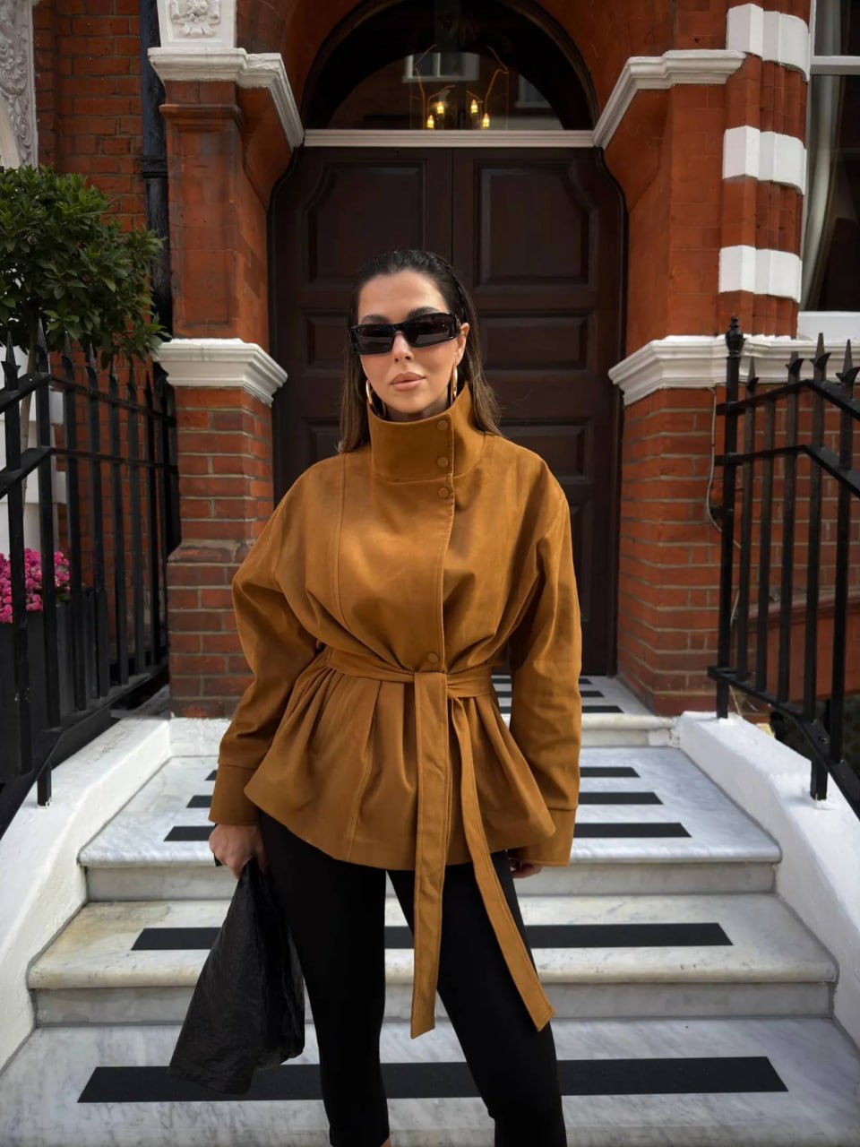 camel-button-jacket-belted-7164 Camel-colored jacket with a tall buttoned collar, front buttons, gathered waist, and long matching belt.