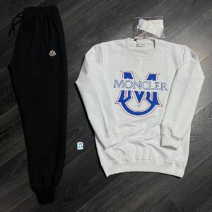 Flatlay of white cotton sweatshirt with large blue-and-red designer-inspired logo, paired with black cuffed joggers. available for wholesale in Turkey.