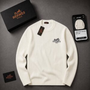 Ivory long-sleeve ribbed sweater with a crew neck and small dark embroidered chest emblem. available for wholesale in Turkey.