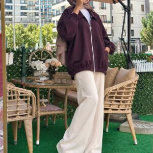 Plum jacket shown from the front with a white zipper, pointed collar, and elasticated cuffs and hem.