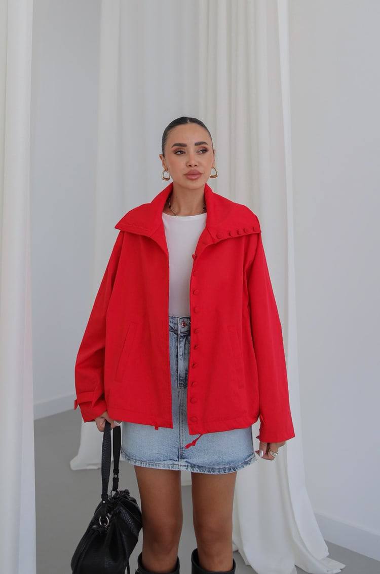 red-jacket-open-front-2746 Front view of a red jacket with a wide collar, covered buttons, long sleeves, and a drawstring hem.