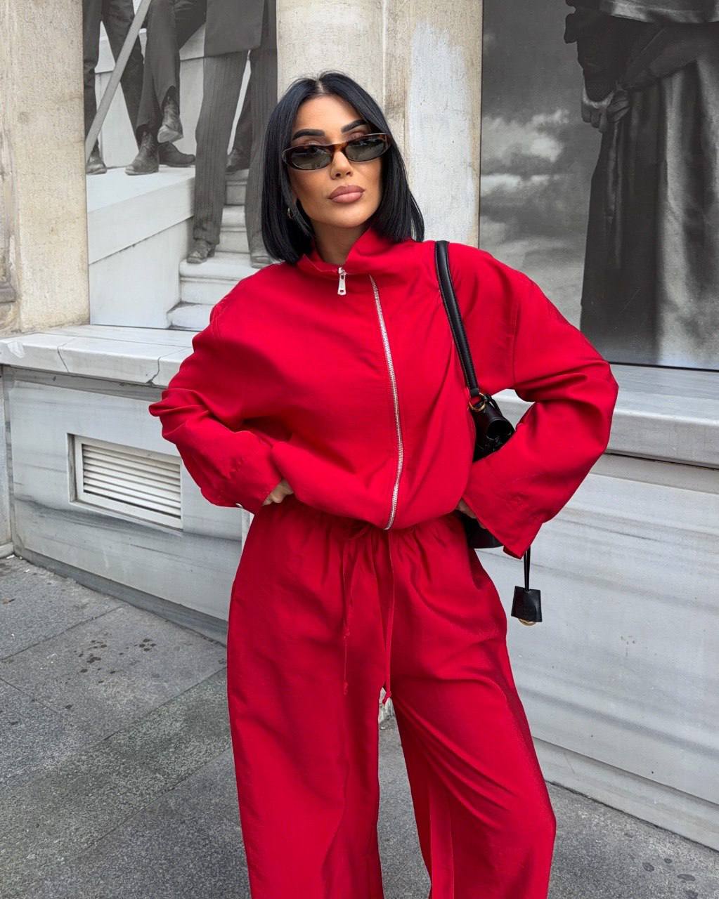 red-zip-jacket-trousers-4086 A red zip-up jacket and loose drawstring trousers are shown together from the front.