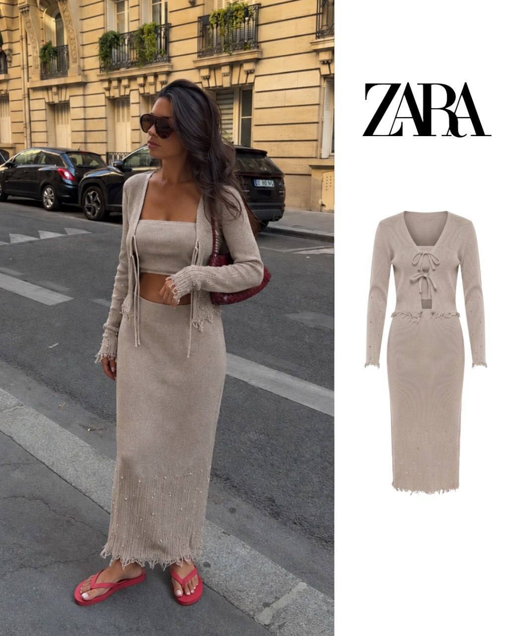 beige-set-product-view-8643 Beige two-piece knit set featuring a tie-front cardigan, fitted long skirt, pearl-like embellishments, and fringed hems.