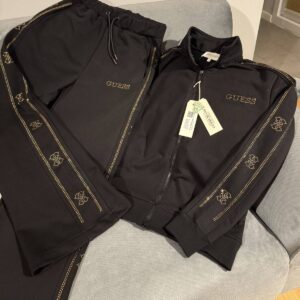 Black zip-up jacket and drawstring pants with gold dotted stripes and decorative motifs. available for wholesale in Turkey.