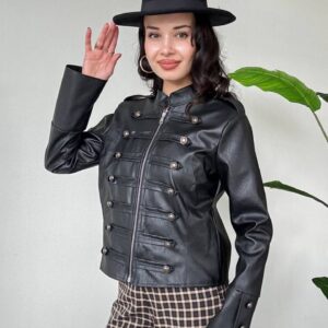 Angled view of a black leather-look jacket with a front zipper, horizontal buttoned tabs, and long cuff panels. available for wholesale in Turkey.