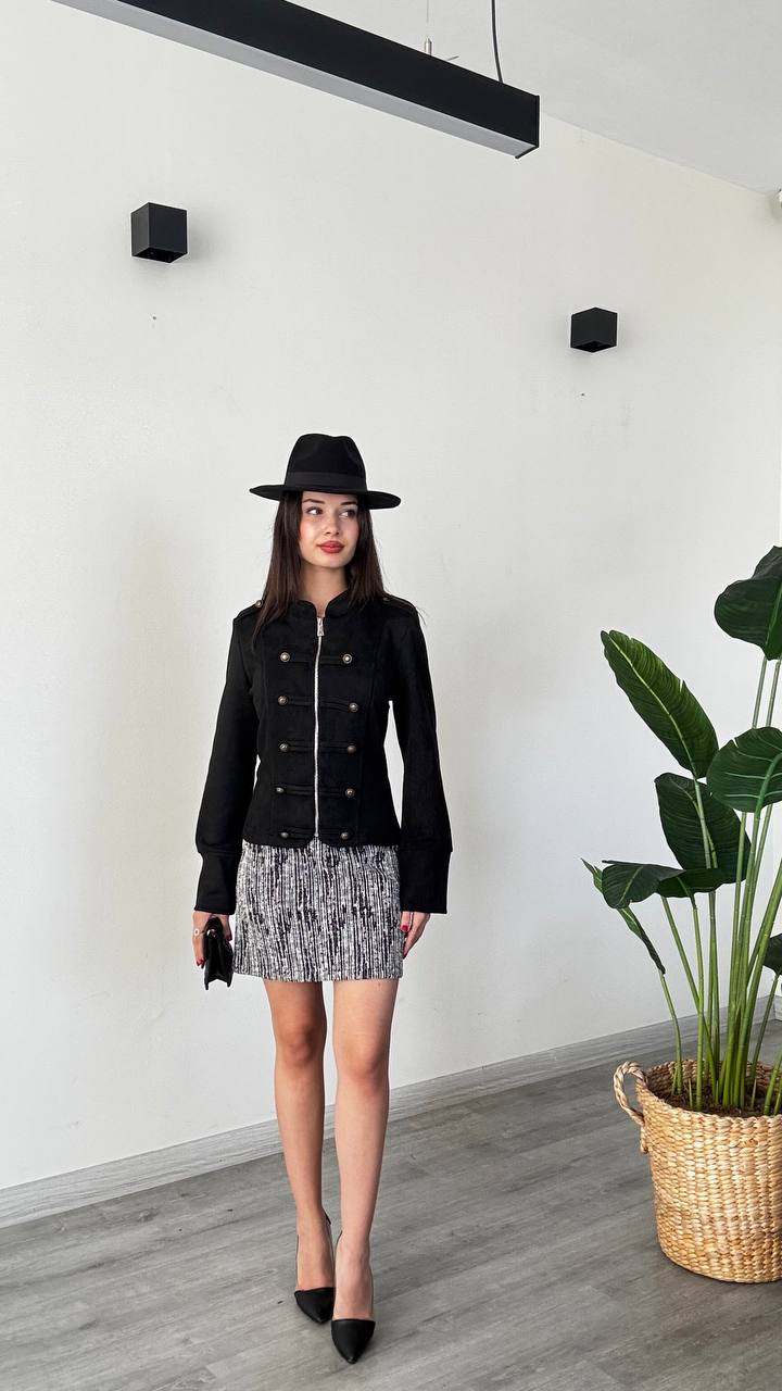 black-jacket-full-outfit-8260 Full outfit featuring a black zip-front jacket with button trim and a black-and-white patterned mini skirt.