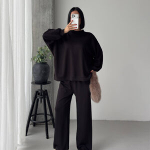 Full-length view of a dark oversized crewneck sweatshirt with balloon sleeves and matching wide-leg trousers. available for wholesale in Turkey.
