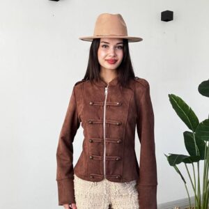 Full-length view of a brown fitted jacket with a central zipper and decorative buttons, paired with cream shorts.