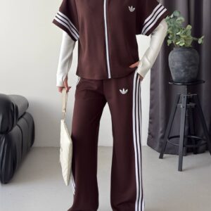 Chocolate brown zip-up hooded top with striped short sleeves and matching wide-leg pants.