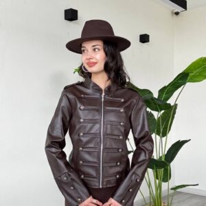 Side-angled view of a dark brown leather-look jacket with a stand collar, front zipper, and buttoned sleeve cuffs.