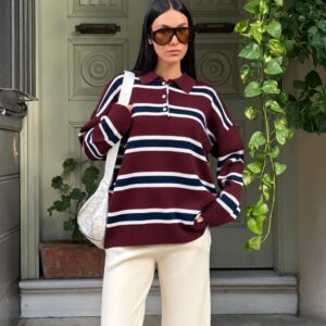 Front view of an oversized burgundy sweater with navy and white stripes, a pointed collar, and button placket. available for wholesale in Turkey.