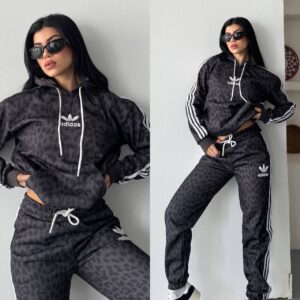 Charcoal hoodie and joggers feature a dark animal pattern, white drawstrings, and striped sleeves and legs.