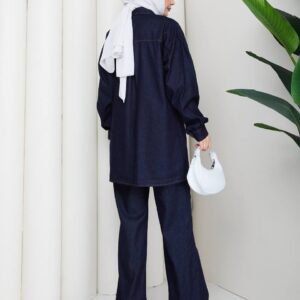 Back view of a dark denim tunic and matching wide-leg trousers with a relaxed fit.