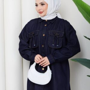 Front view of a dark denim tunic with gold-tone buttons, oversized flap pockets, and voluminous sleeves. available for wholesale in Turkey.