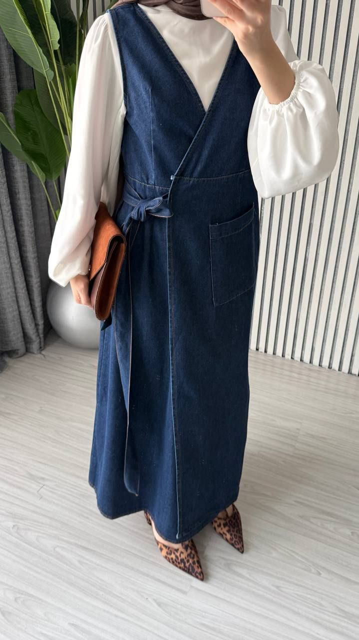 dark-denim-wrap-detail-6504 Close view of a dark denim wrap front with a tied waist and long skirt.