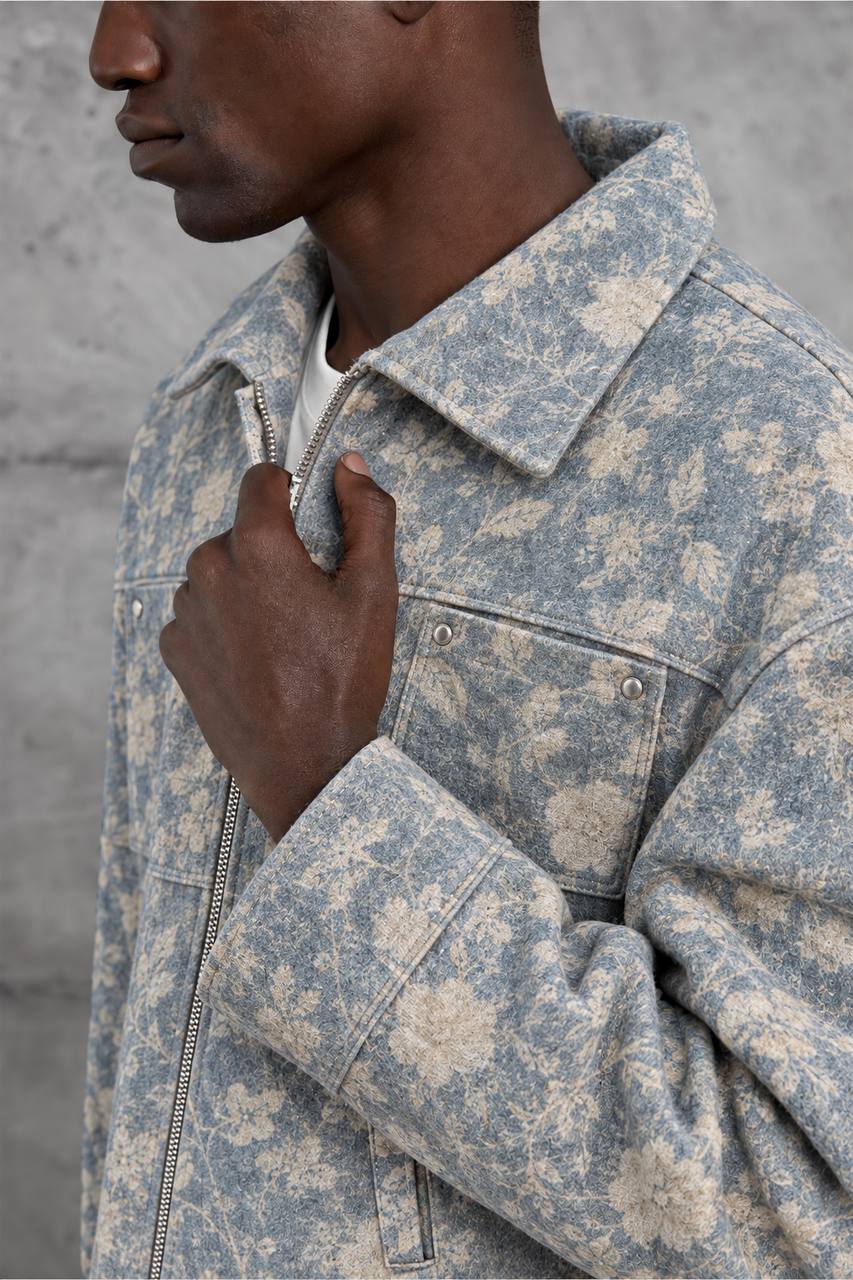 floral-jacket-detail-7364 Close-up of the jacket's cream floral pattern, pointed collar, metal zipper, and snap-fastened chest pocket.