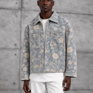 Front view of a blue floral jacket with a pointed collar, zip closure, and two chest pockets. available for wholesale in Turkey.