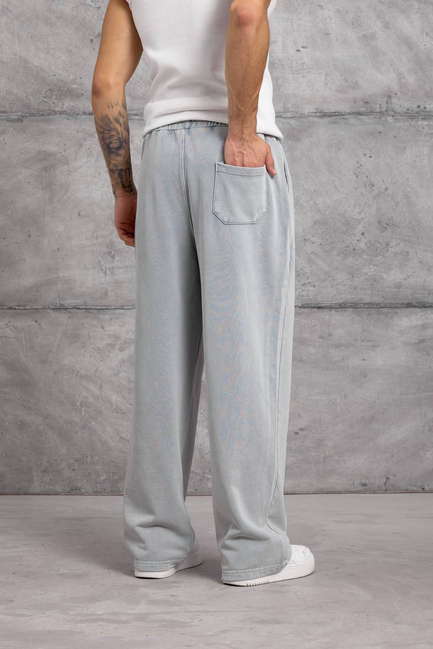 light-gray-back-pocket-sweatpants-1938 Rear view of light gray wide-leg sweatpants with one patch pocket and long, loose-fitting legs.