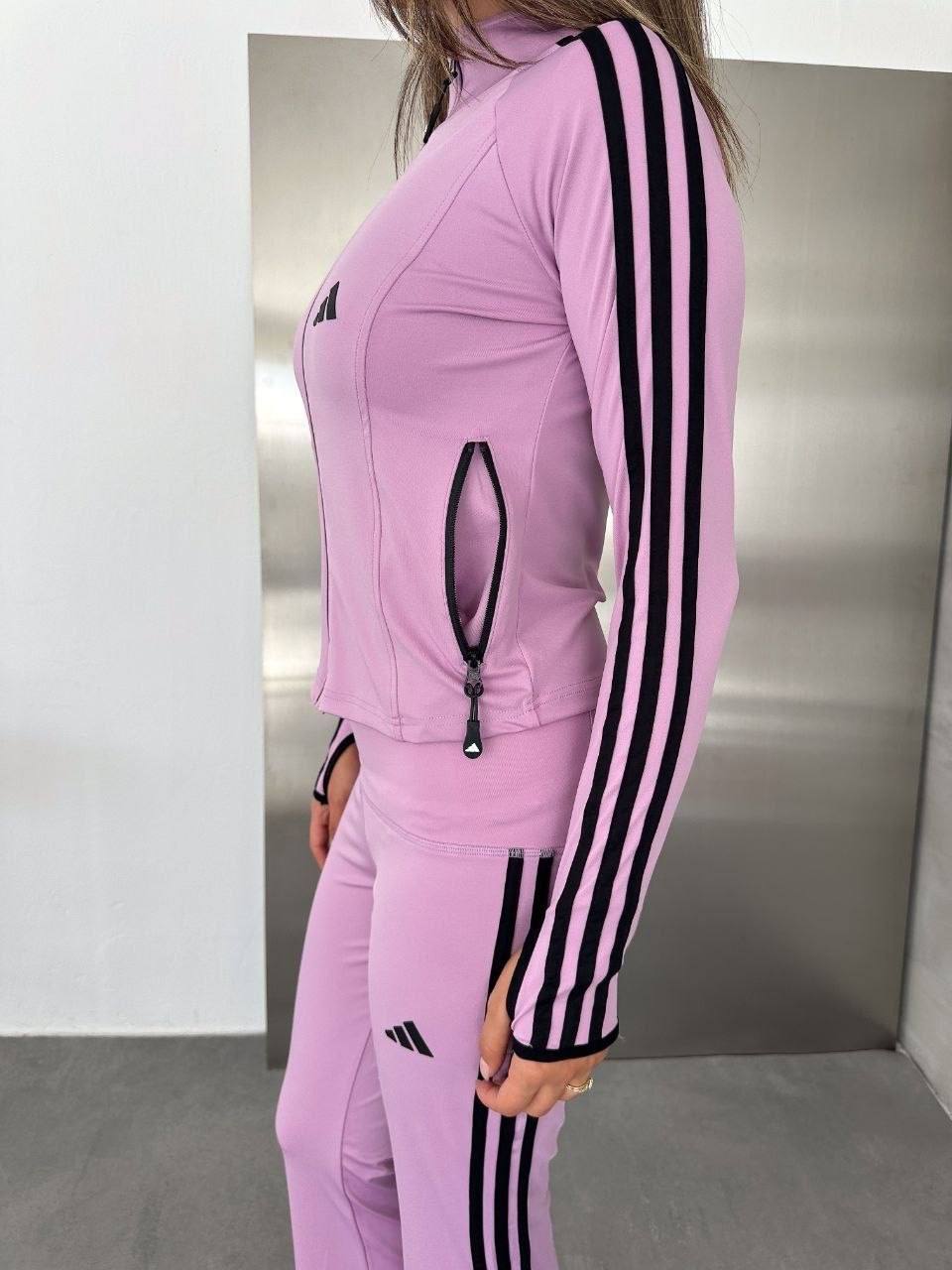 lilac-sleeve-detail-9143 Close view of a lilac jacket sleeve with three black stripes, alongside matching pants.