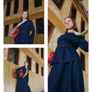 Model wearing a belted navy tunic over a long skirt with a cream patterned scarf. available for wholesale in Turkey.