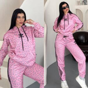 Pink hoodie and joggers with gray animal print, black drawstrings, and side stripes. available for wholesale in Turkey.