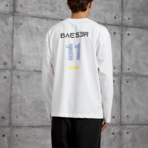 Rear view of a white long-sleeve shirt with dark lettering, a large blue number, and a small yellow accent.