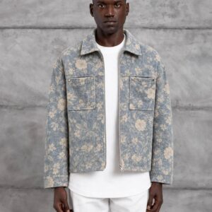 Model wearing a blue floral jacket open over a white shirt, with two front pockets and a metal zipper.